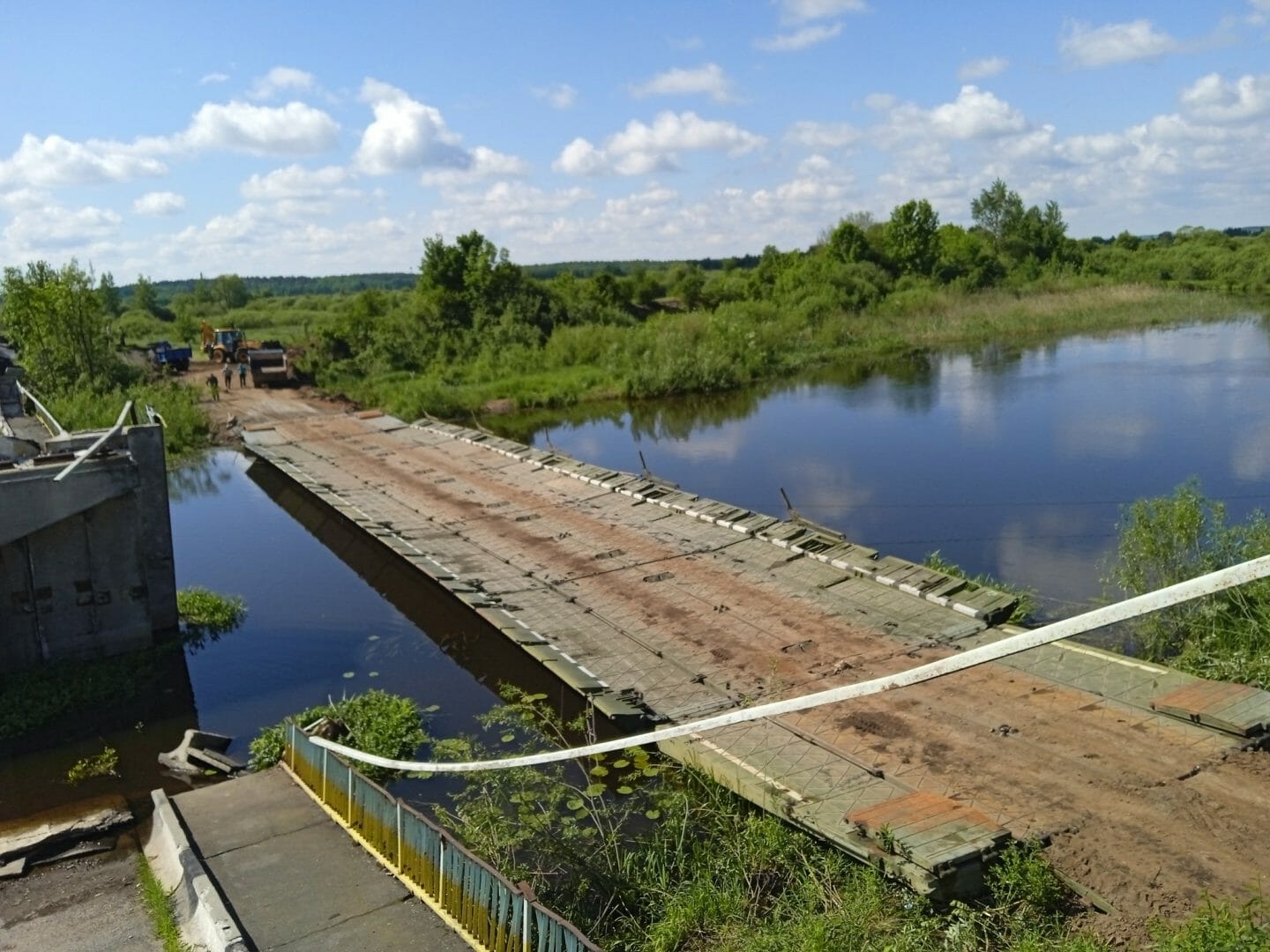 Pontoon crossing in place of destroyed bridge on the Uzh river