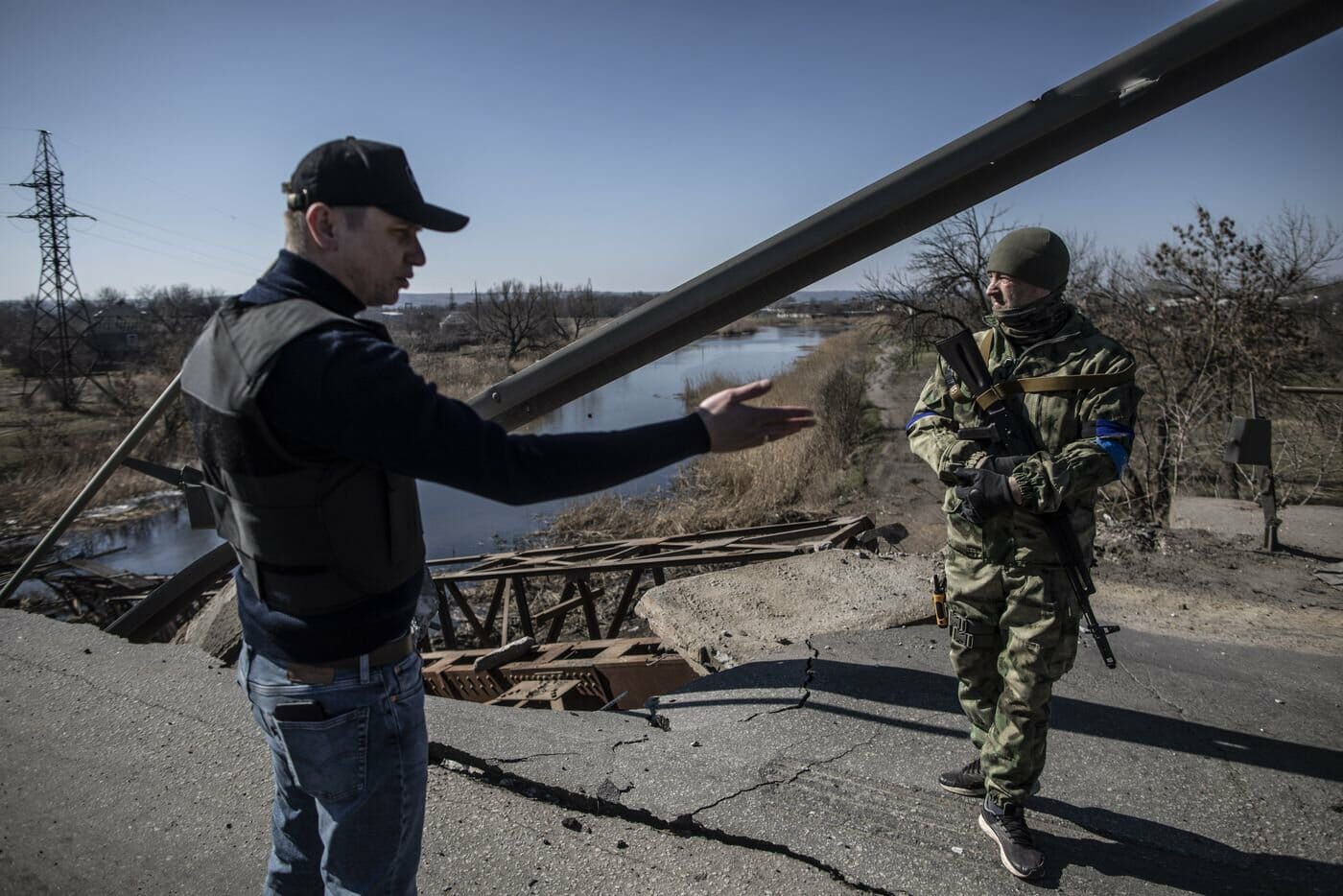 Mayor of Voznesensk Yevheniy Velychko (to the left) on the bridge that was blown up by Ukrainian military engineers