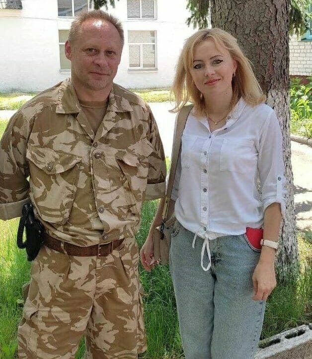 Settlement Head Irena Lisova with a defender of Ukraine.