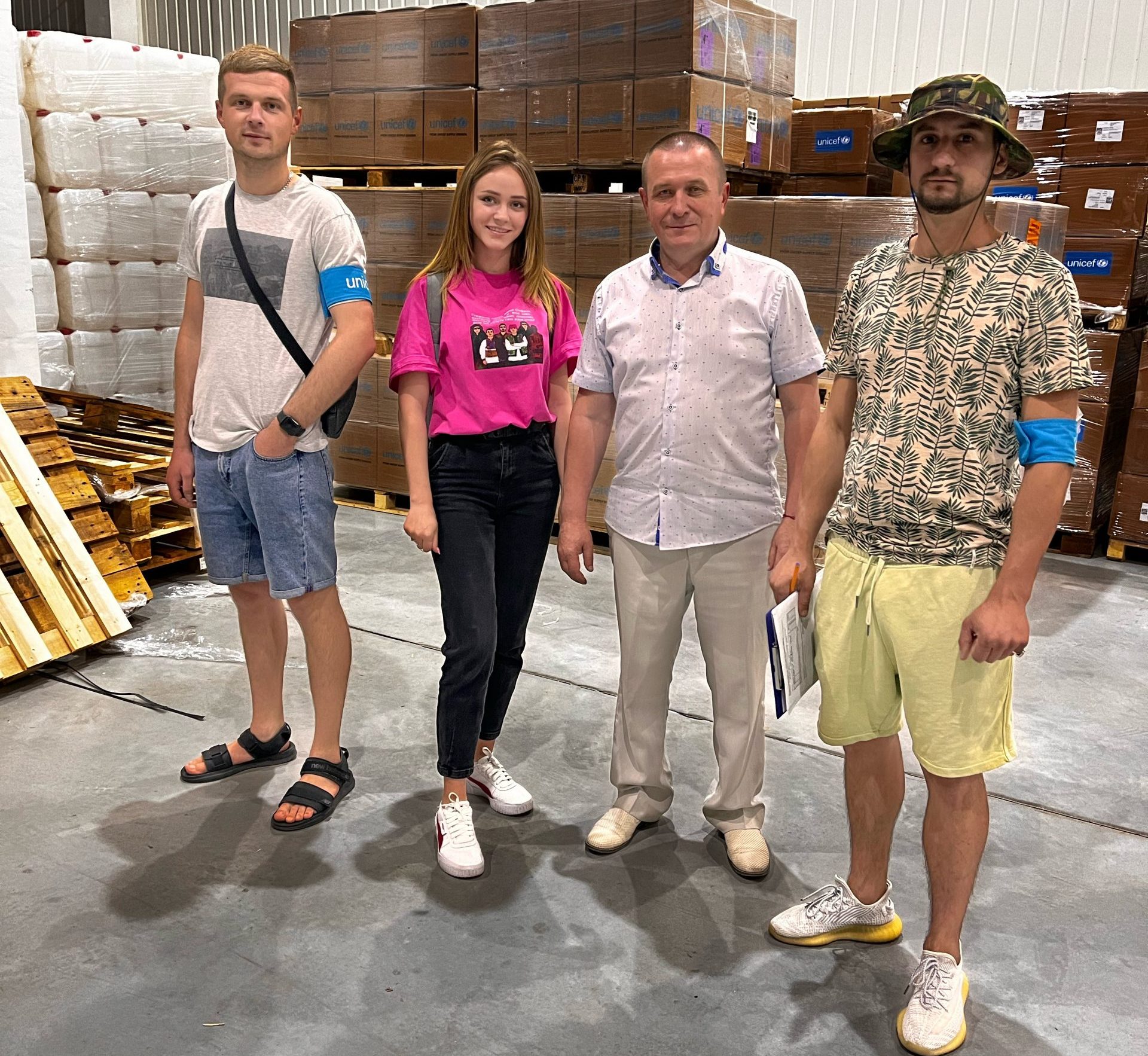Receiving humanitarian aid. In the photo (from left to right) a volunteer of the Territory of Success NGO, an employee of the Novoarkhangelsk settlement council, the head of the Novoarkhangelsk settlement council and a volunteer of the Territory of Success NGO. 
