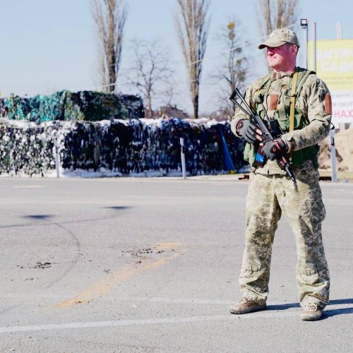 A Ukrainian military at the checkpoint in the Hora Community
