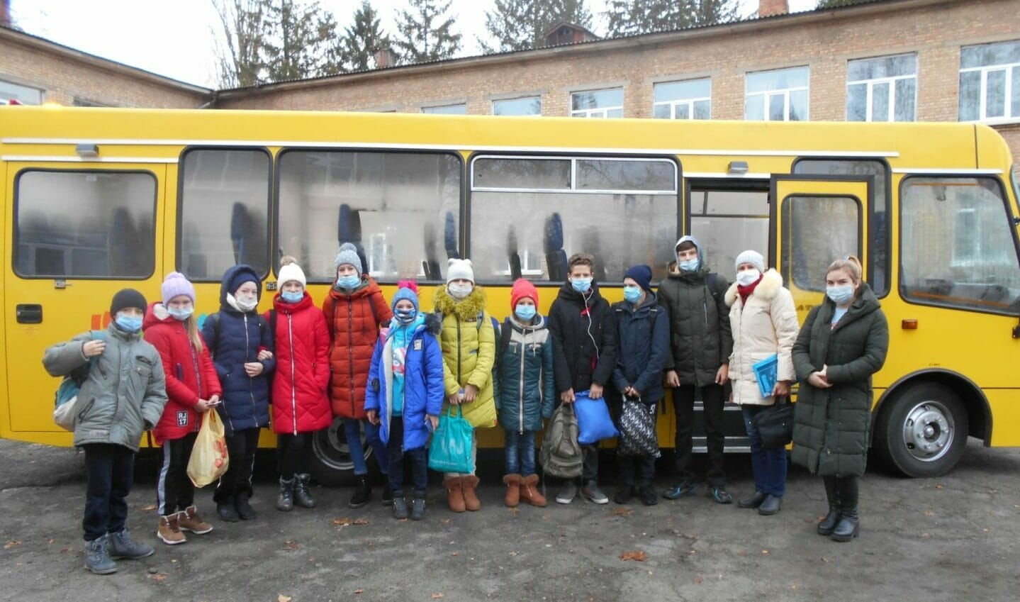 A new bus taking students and teachers to school