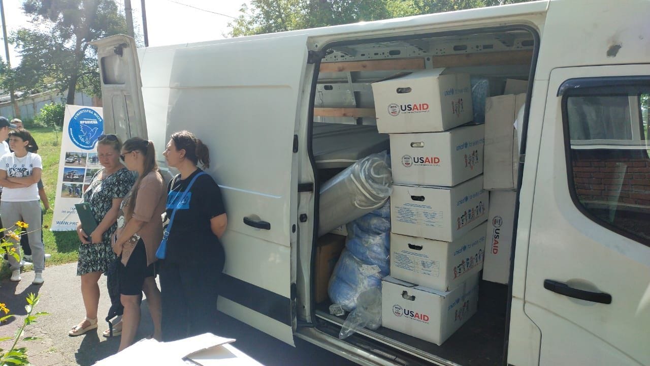 Humanitarian aid being unloaded and distributed