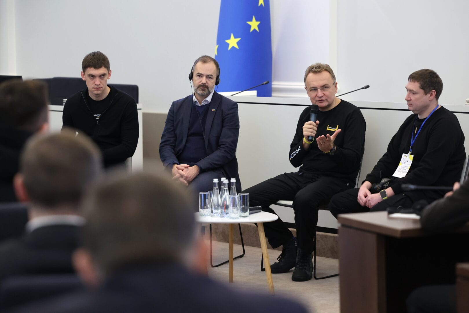 The mayors of Melitopol, Aarhus, Lviv, and the head of the Lviv Regional Military Administration during a panel at the forum.