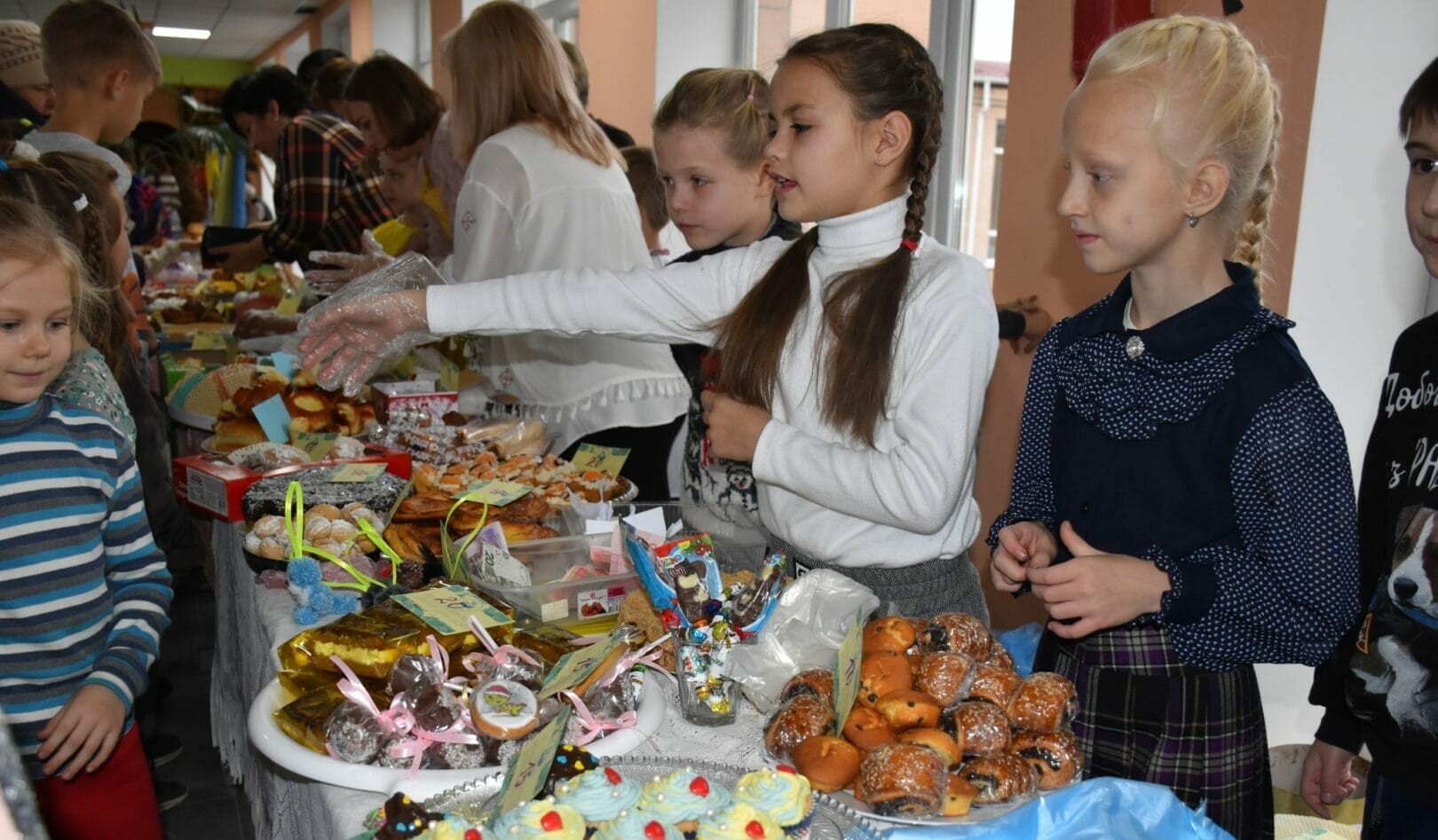 Lyceum students holding a charity fair