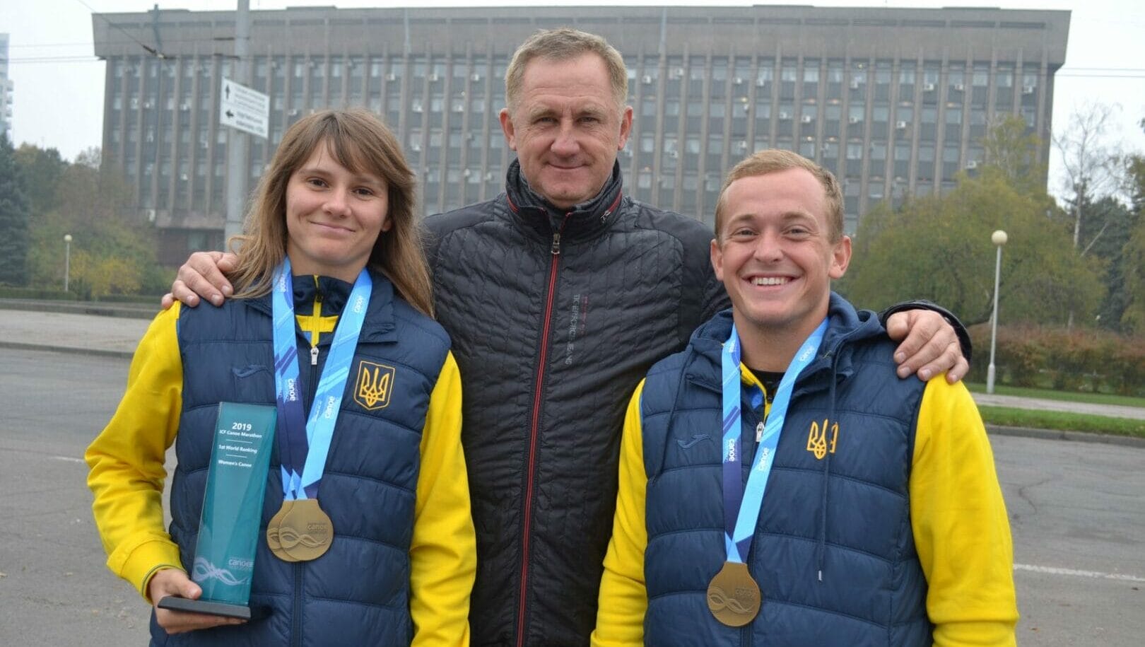 Honored Coach of Ukraine Sergiy Snezhko with his protégés - World Champion Lyudmyla Babak and European Champion Denis Davidov (source - Enerhodar City Council)