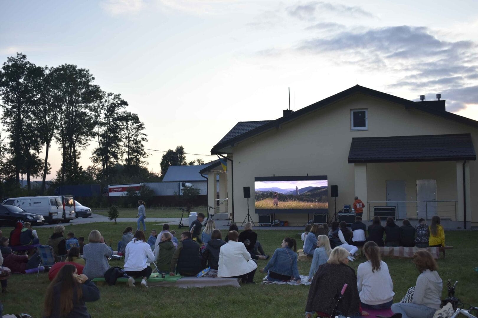 Watching a film outdoors in a park of the village of Murovane