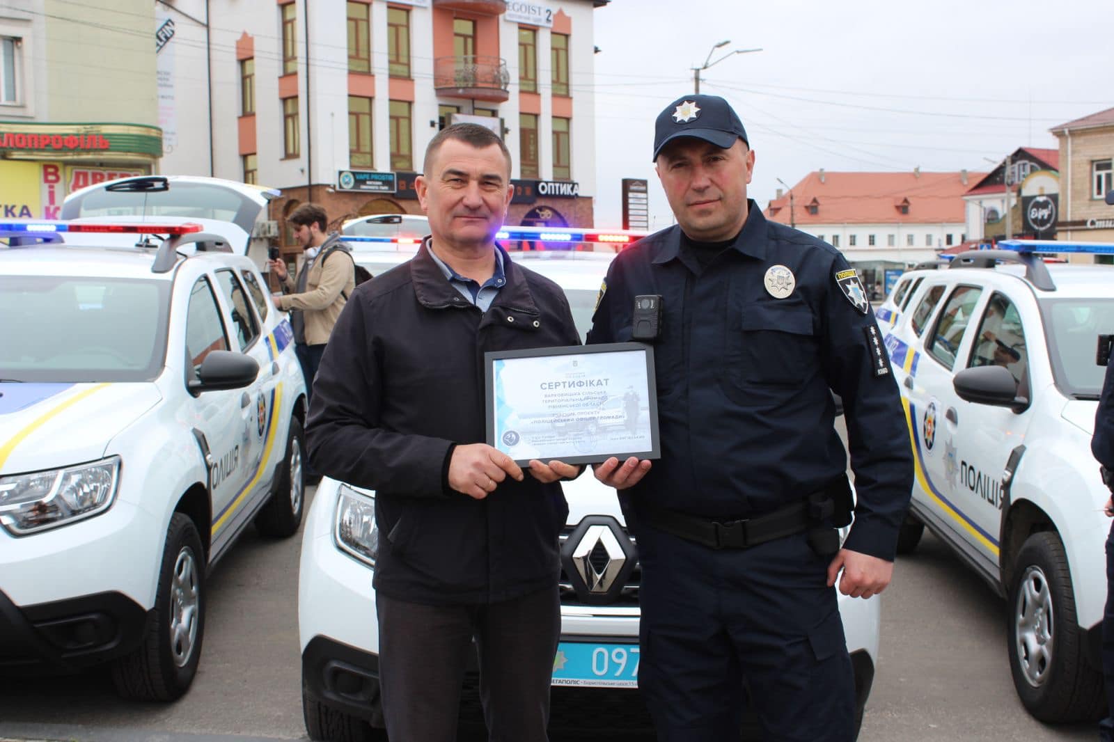 Yurii Parfeniuk (left) with a community police officer