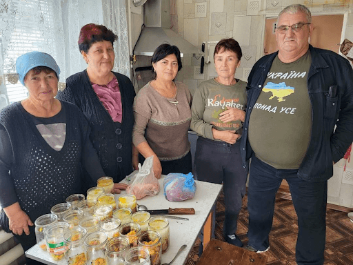 A group of volunteers who produce canned meat and fish for the Armed Forces