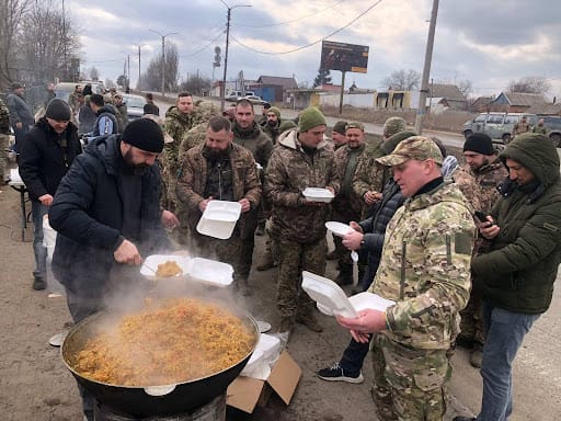 Volunteers from the village of Kamianka, Chernivtsi region, travelling to the Donetsk region