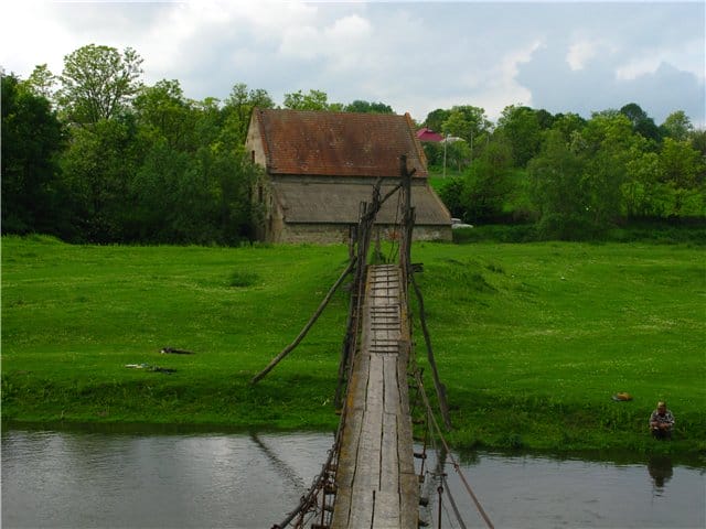 Water mill under a tiled roof in the village of Shydlivtsi