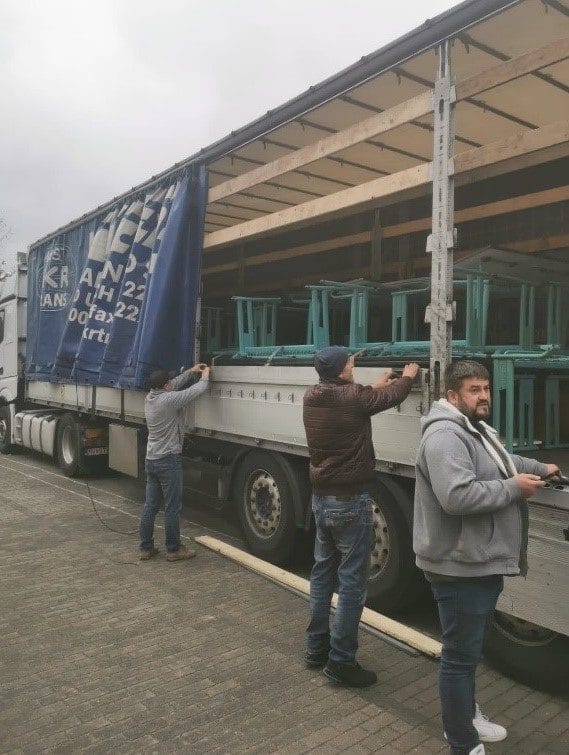 Unloading humanitarian cargo for schools from the town of Baruth /Mark (Germany)