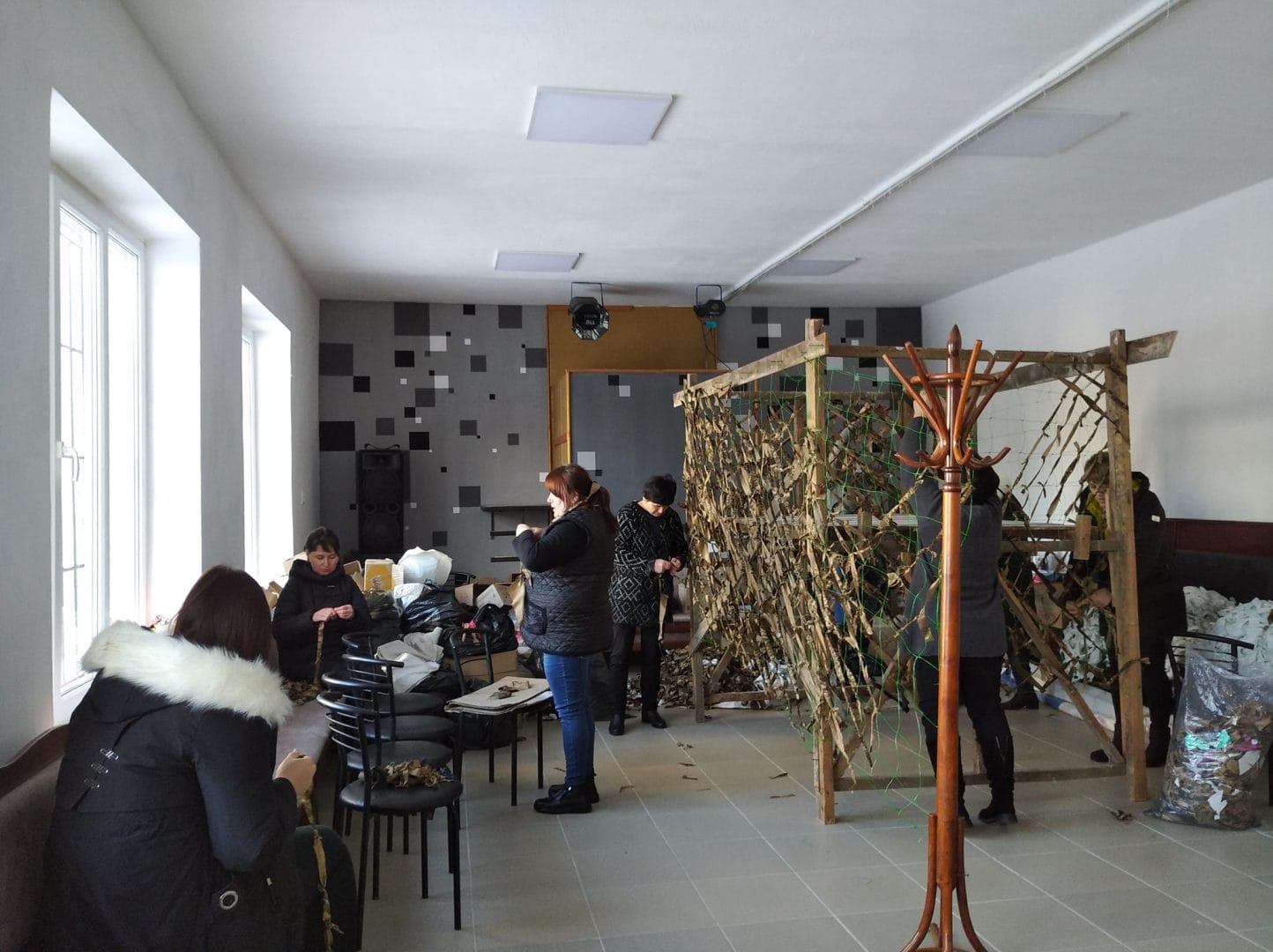 Weaving camouflage nets in the humanitarian hub of Rozhniativ