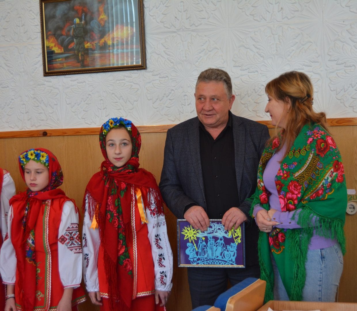 The head of the community with carolers