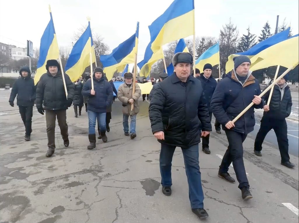 The mayor (center) during a rally on March 9, 2022 in support of Ukraine's sovereignty