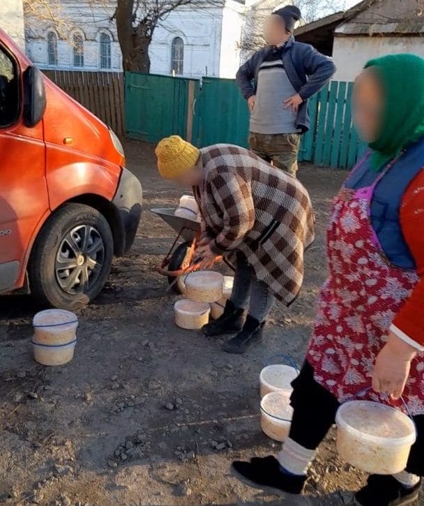 Community volunteers preparing canned meat and sauerkraut for the Armed Forces of Ukraine