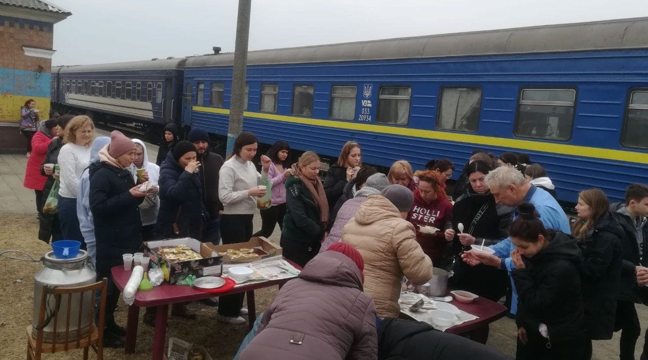 Meeting passengers of evacuation trains at the Luboml railway station