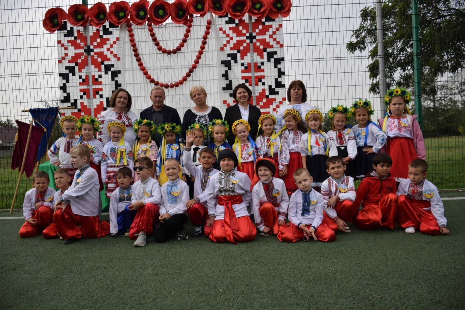 Children of the community together with the leadership team