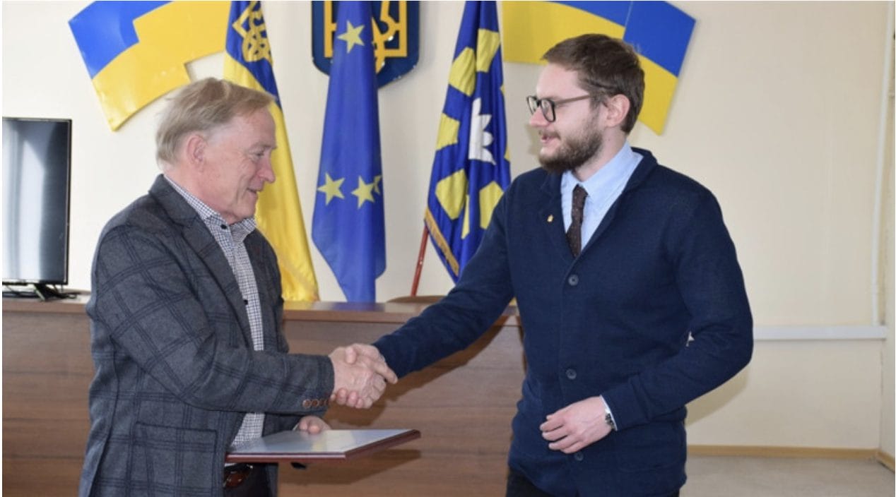 Regional program coordinator Ivan Kopychenko presenting the award