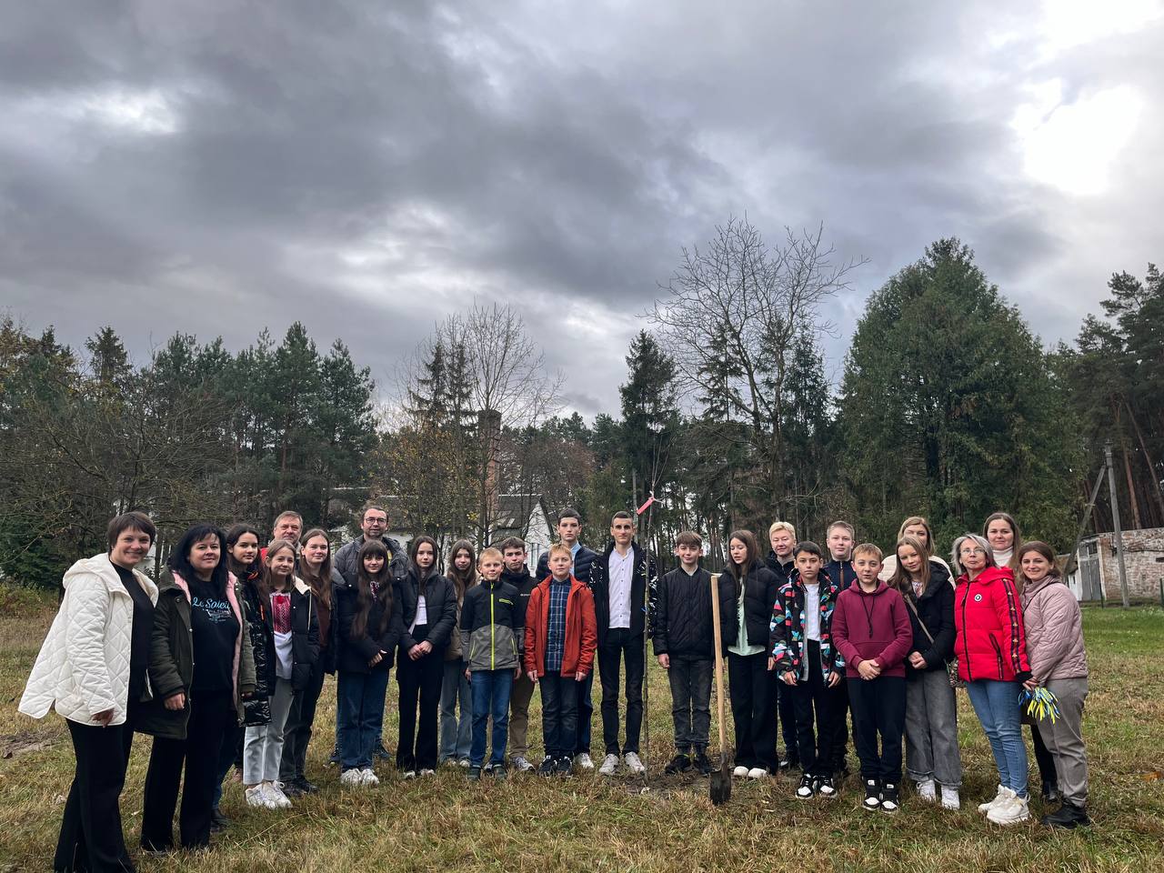 Planting trees brought from Germany as part of the project