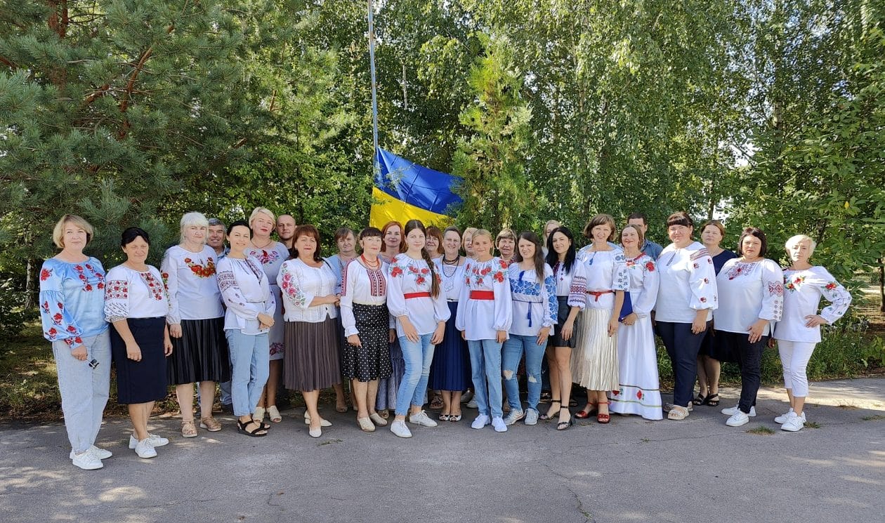 The Head of the Community (centre) with the management team on the Day of the National Flag