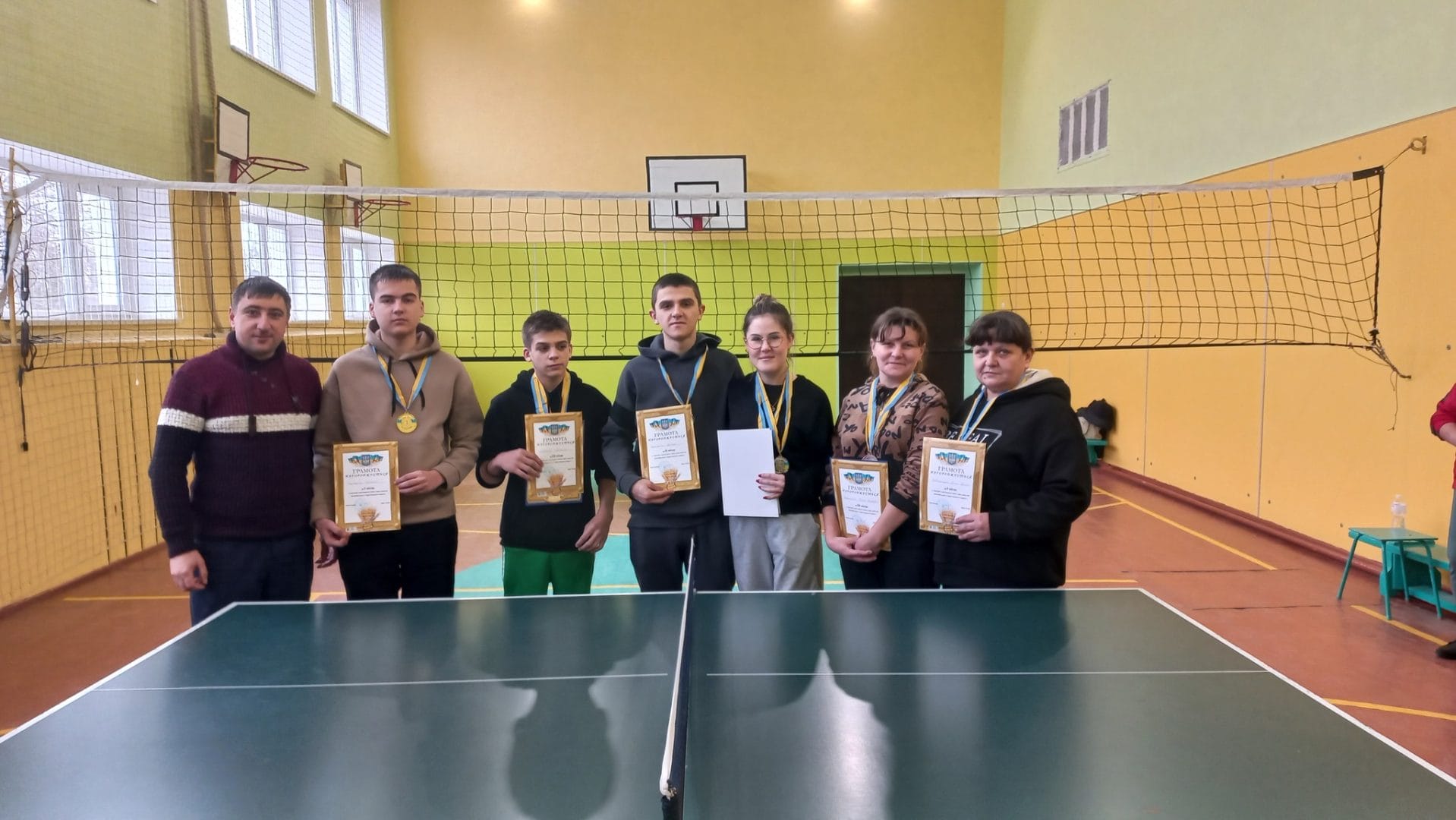 Awarding the winners of table tennis and darts competitions.