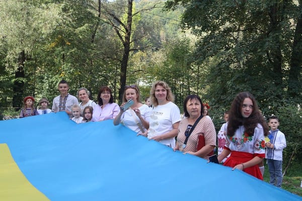 Community Residents with the Ukrainian Flag at a Community Event