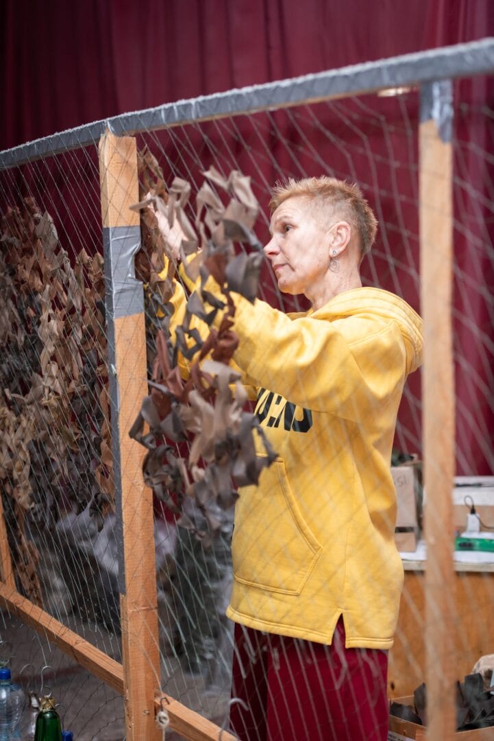 Weaving camouflage nets in the city's House of Culture (by Oleksii Nakonechnyi)